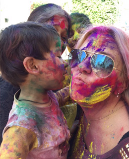 TravelAstu Guest Claudia celebrating Holi festival with a Hindu child